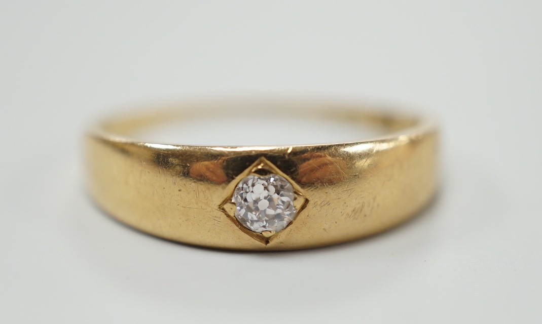 An early 20th century 18ct gold and gypsy set solitaire diamond ring, size M, gross weight 3.2 grams